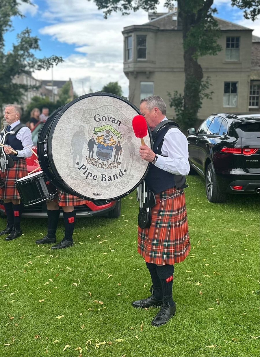 Close-up of the bass drummer with the Govan Pipe Band crest